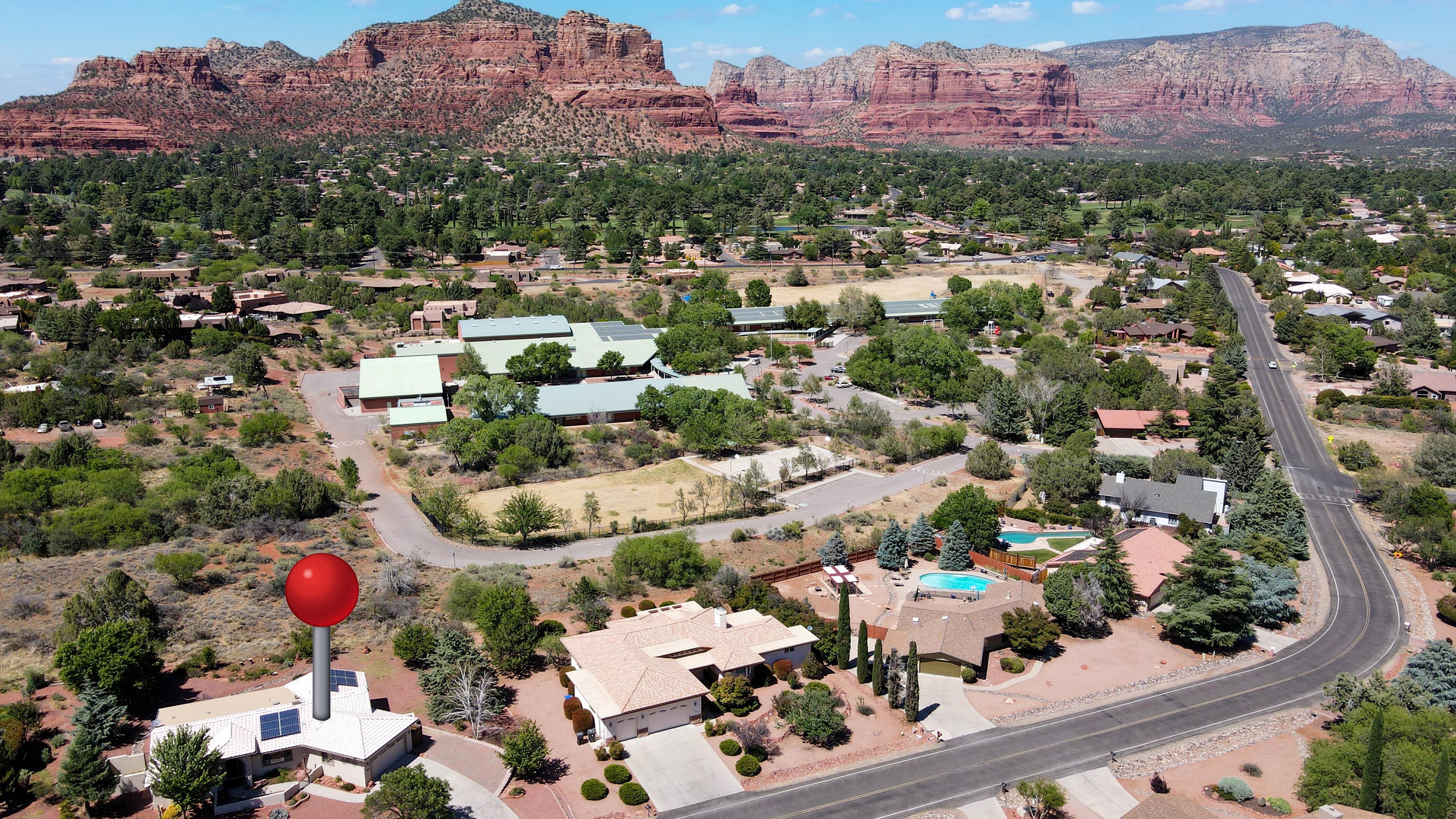 Overhead drone view of property and surrounding desert landscape